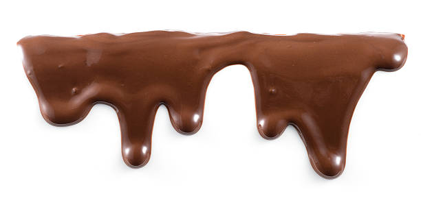 Melted chocolate is dripping. Streams isolated on white. Melted chocolate is dripping. Streams isolated on white. melting stock pictures, royalty-free photos & images