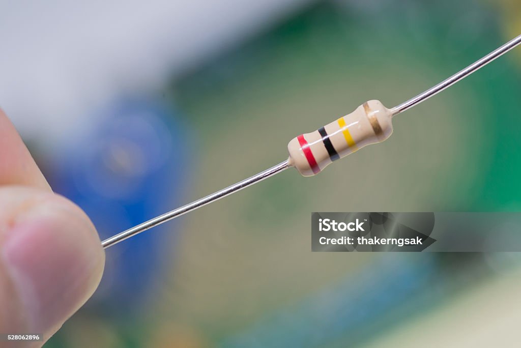 Closeup 200k Or 200000 Ohms Resistors Against Electronic Board Stock Photo  - Download Image Now - iStock