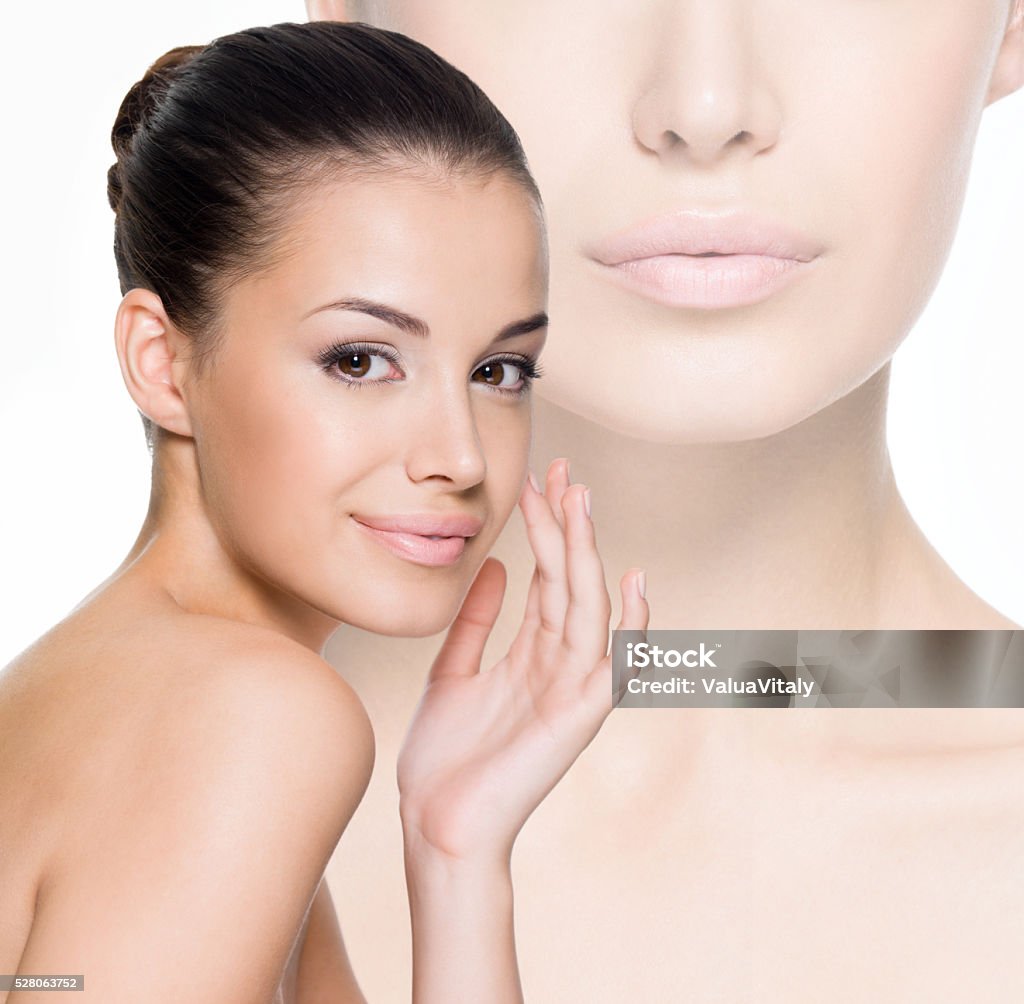 Beautiful woman cares for the face Beautiful woman cares for the skin face- posing at studio  isolated on white Adult Stock Photo