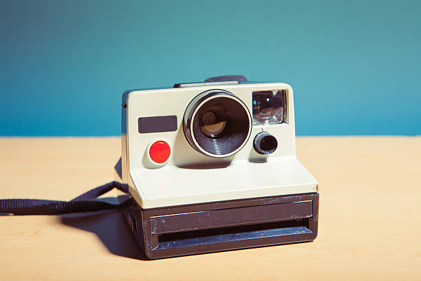 Vintage photography Old instant camera isolated on a table vintage camera stock pictures, royalty-free photos & images