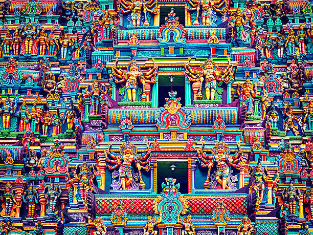 Vintage retro effect filtered hipster style image of statues on Hindu temple gopura (tower). Menakshi Temple, Madurai, Tamil Nadu, India