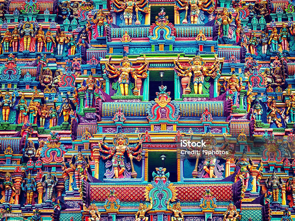 Sculptures on Hindu temple tower Vintage retro effect filtered hipster style image of statues on Hindu temple gopura (tower). Menakshi Temple, Madurai, Tamil Nadu, India Madurai Stock Photo