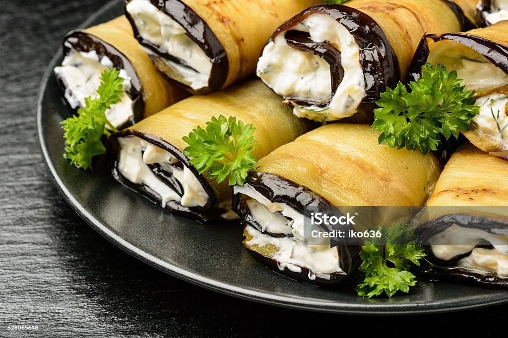 Appetizer, eggplant rolls stuffed with creme cheese, garlic and greens. Appetizer - eggplant rolls stuffed with creme cheese, garlic and greens.  Appetizer Stock Photo