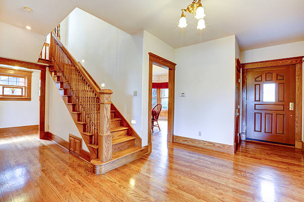 istock Empty entrance hallway with wooden staircase 528066259