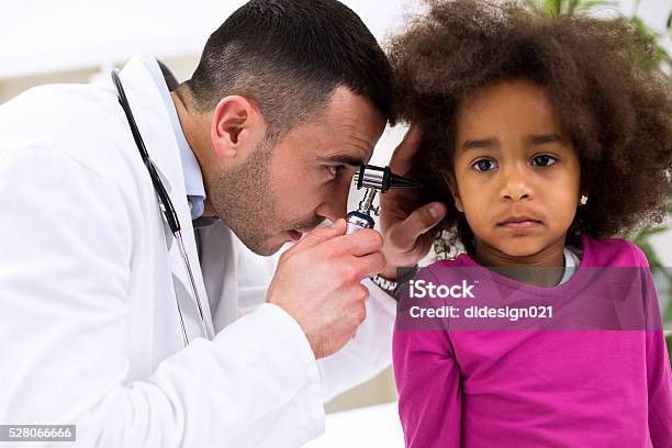 Pediatrician Using Otoscope Stock Photo - Download Image Now - African Ethnicity, Ear Exam, 2-3 Years