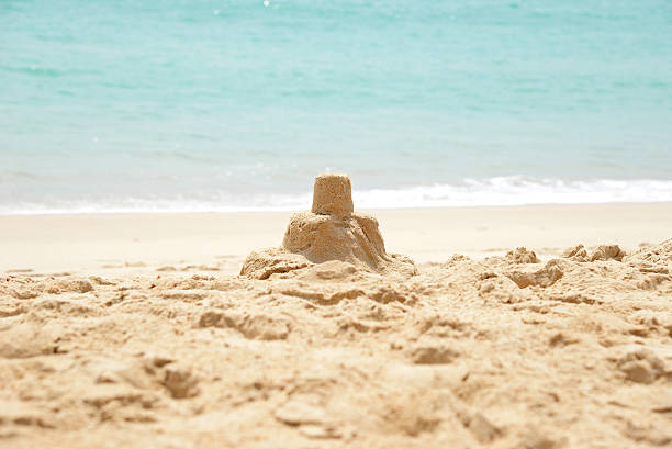 istock sandcastle on a sandy beach with blue sea 528067004
