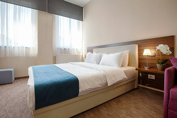 istock Elegant hotel bedroom interior 528067512