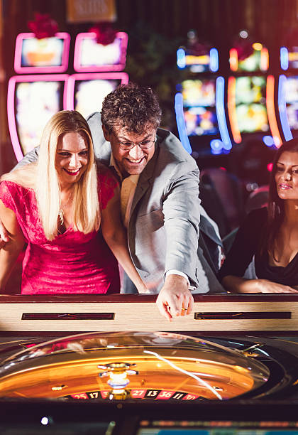 istock Friends playing roulette at the casino 528067772