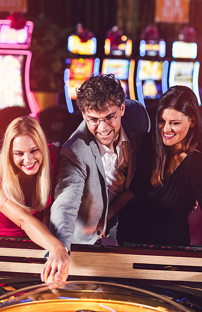 istock Friends playing roulette at the casino 528067916