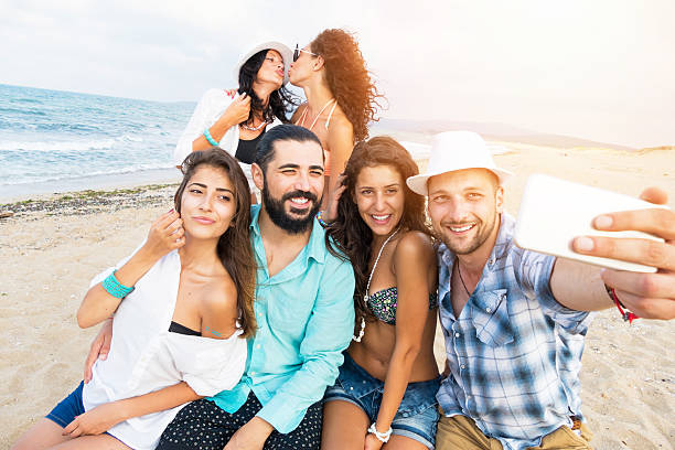 istock Group of friends making memories on the beach 528069236