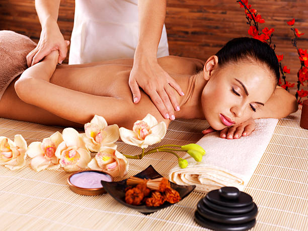 istock Masseur doing massage on woman body in spa salon 528070061