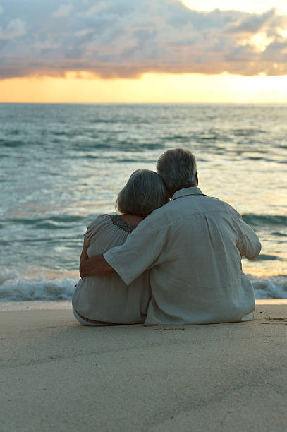 istock elderly couple rest at tropical beach 528070256