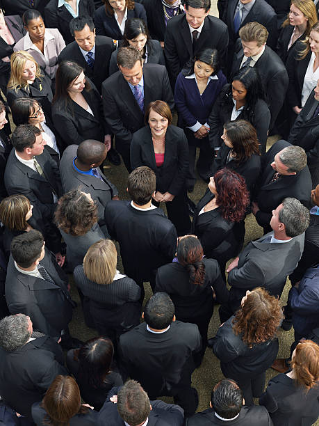 istock Business Group Looking At Woman In Middle 528070721