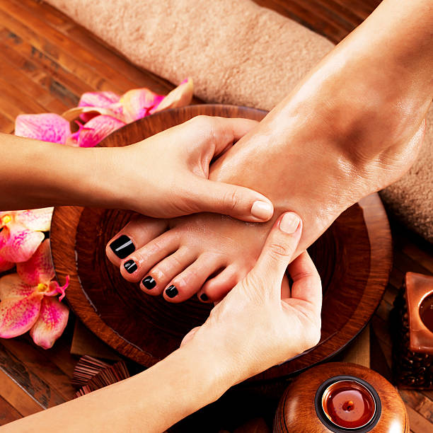 istock Massage of woman's foot in spa salon 528070864