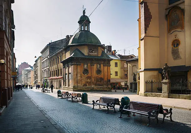 Lviv is a historical city with medieval buildings. The building on the right (with the statue) is a 14th-century Roman Catholic cathedral named "Latin Cathedral". It is located in the city's Old Town, in the south western corner of the market square, called Cathedral Square.