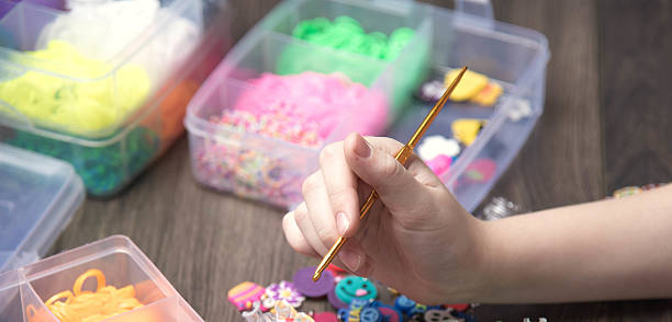 istock children's hands are weaving figures out colored rubbers 528072764
