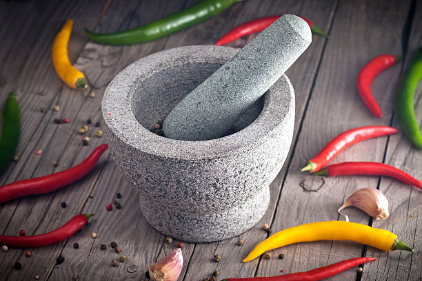 istock Stone Mortar on a wooden bench. 528100061