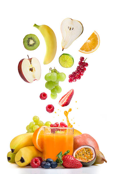 istock Fresh fruit over glass of multi vitamine juice 528100701
