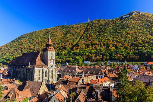 Brasov and it's most important landmark, the Black Church towers over the old town. Transylvania, Romania.