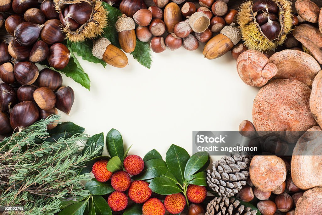 Frame with space for text, with autumn and Christmas items Frame with space for text, with naltural autumn and Christmas items fruits and nuts Acorn Stock Photo