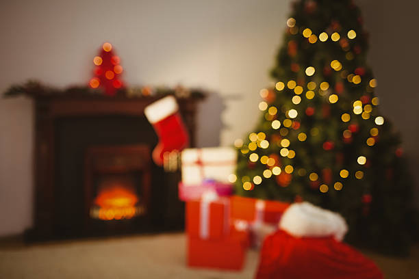 istock Christmas tree with presents near the fireplace 528102843