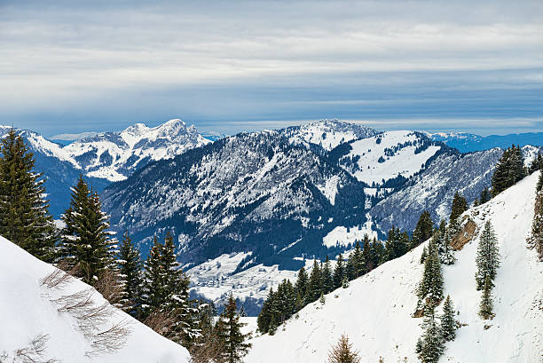 istock Winter Alpine landscape framed by firs forest slopes 528105585