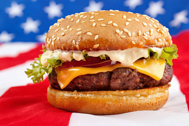 istock Cheeseburger with USA flag on background 528106379
