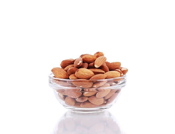 istock Glass bowl full of almonds. 528106909