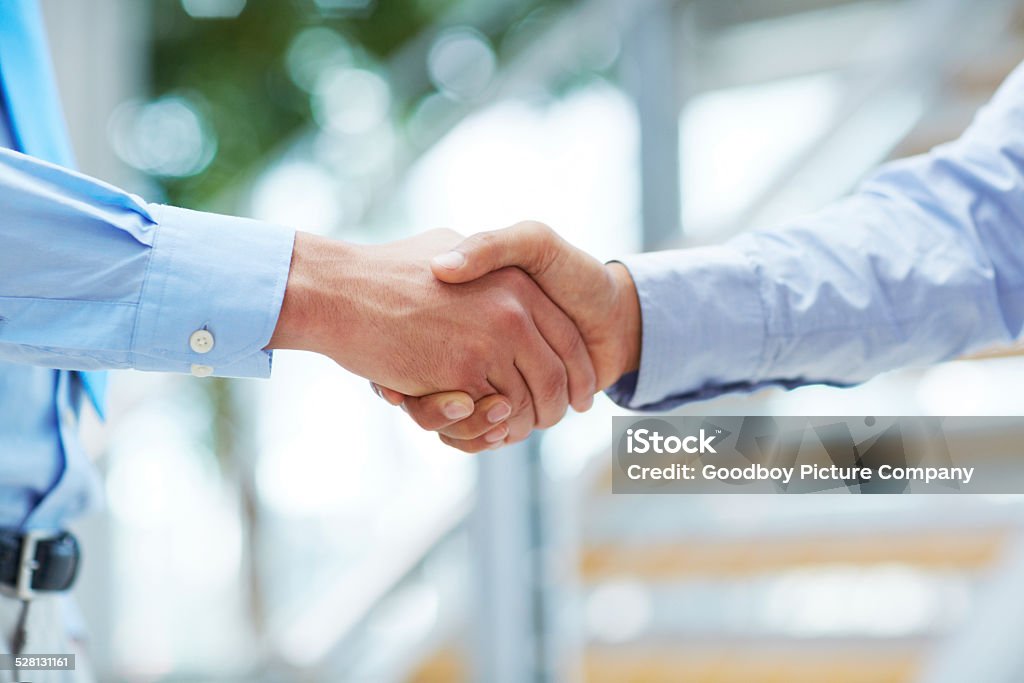 It's great to meet you Cropped shot of two businessmen shaking hands Achievement Stock Photo