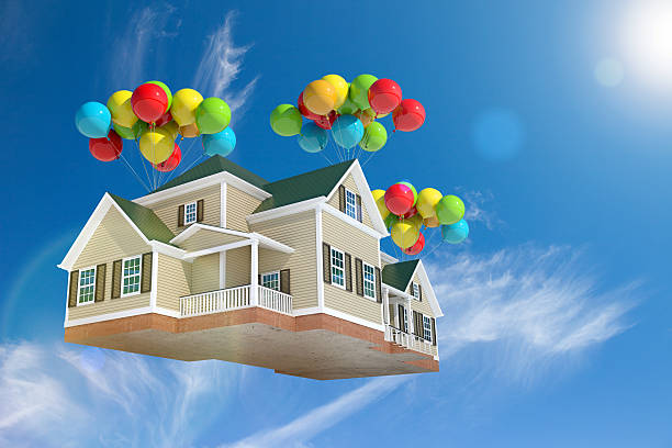 istock Home flying in the sky with balloons, with sun 528132073