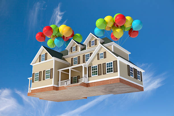 House suspended in mid air, flying high in the sky, transported by colorful balloons. Moving away, dreamy scene, relocate.