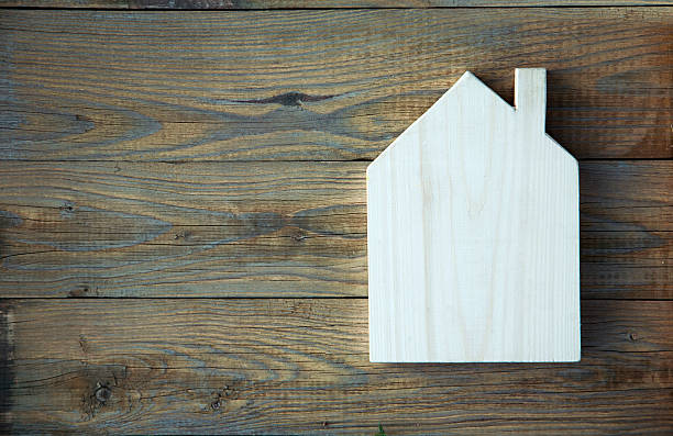 istock House Shaped Chalkboard sign  on rustic wood 528133035