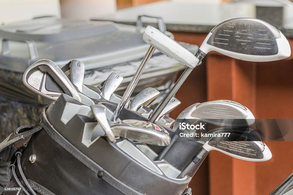 Bag of golf clubs. South Africa, November 2014. Golf is a precision club and ball sport in which competing players (or ) use various  to hit balls into a series of holes on a course using as few strokes as possible. Picture taken in a golf club in South Africa, near Pretoria. Accuracy Stock Photo