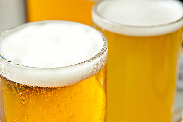 Fresh and foamy beer Three glasses of fresh and foamy beer just served pilsen stock pictures, royalty-free photos & images