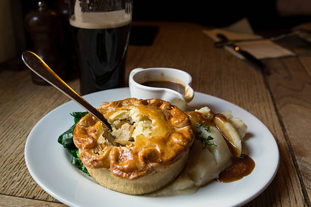 Meat Pie Traditional English pub chicken pot pie british currency stock pictures, royalty-free photos & images