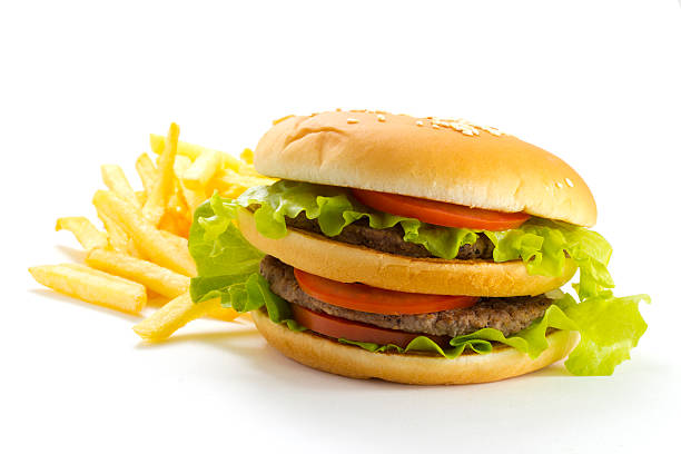 istock Big and tasty hamburger and fried potatoes isolated 528147377