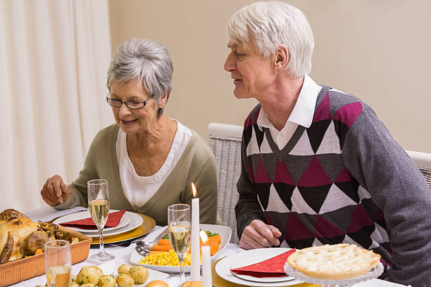 istock Senior citizen looking roast turkey during christmas dinner 528147903