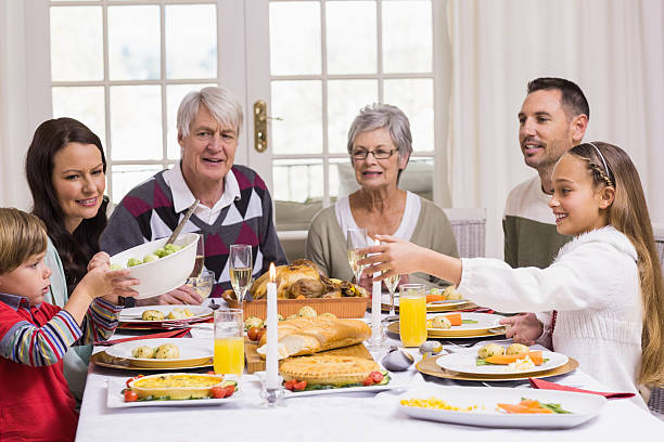 istock Smiling extended family at the christmas dinner table 528148209