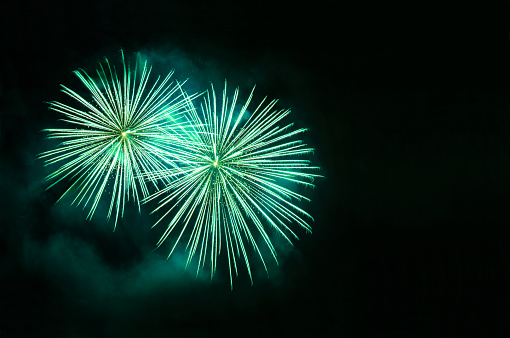Fireworks on a dark background with space for copy.