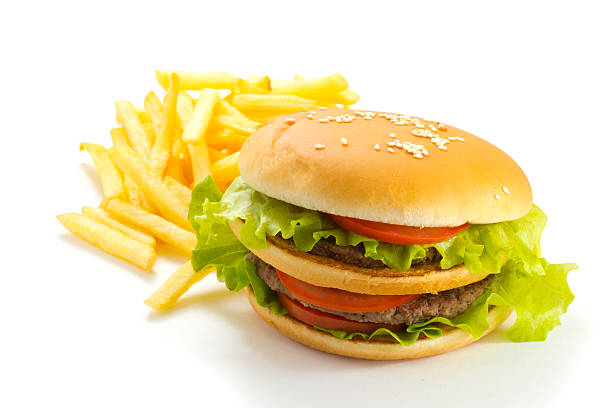 istock Big and tasty hamburger and fried potatoes isolated 528149015