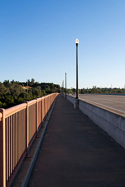 istock Empty Pedestrian Walkway Over Bridge Morning Blue Sky 528149399
