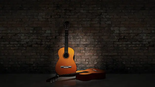 Photo of Acoustic guitar leaning on grungy wall