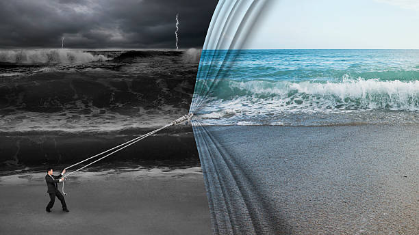businessman pulling open calm sea curtain covered dark stormy oc stock photo