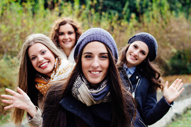 istock Beautiful young women waving 528150609