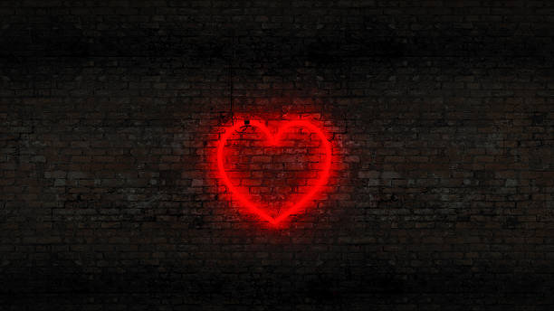 istock Neon heart on the brick wall 528151037