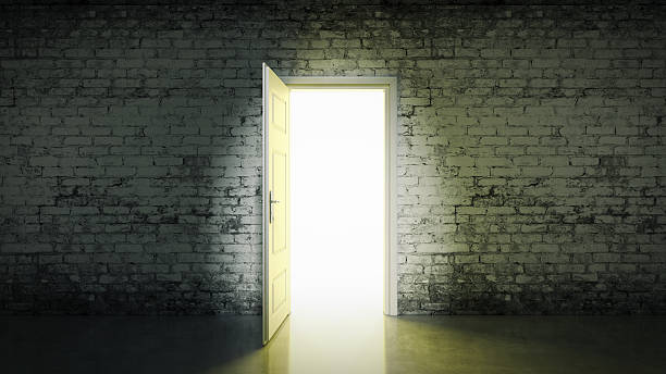 istock white brick room and open door light 528151281