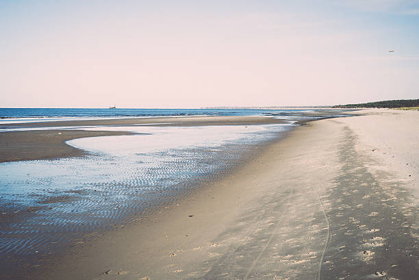 istock icy sea beach with first ice pieces. Vintage. 528152885