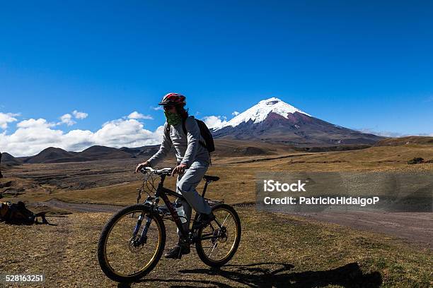 Cyclist And Cotopaxi Volcano Stock Photo - Download Image Now - Bicycle, Ecuador, Cycling