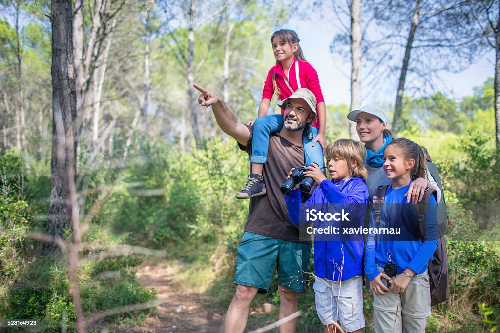 Having a great time in the woods Family hiking in the woods . 35-39 Years Stock Photo