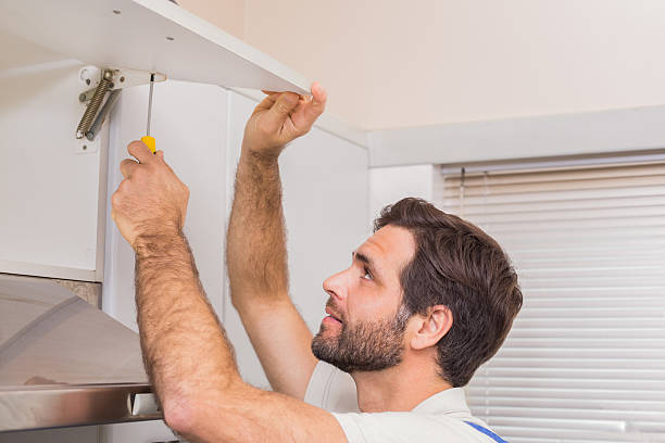 istock Handyman putting up a shelf 528165879